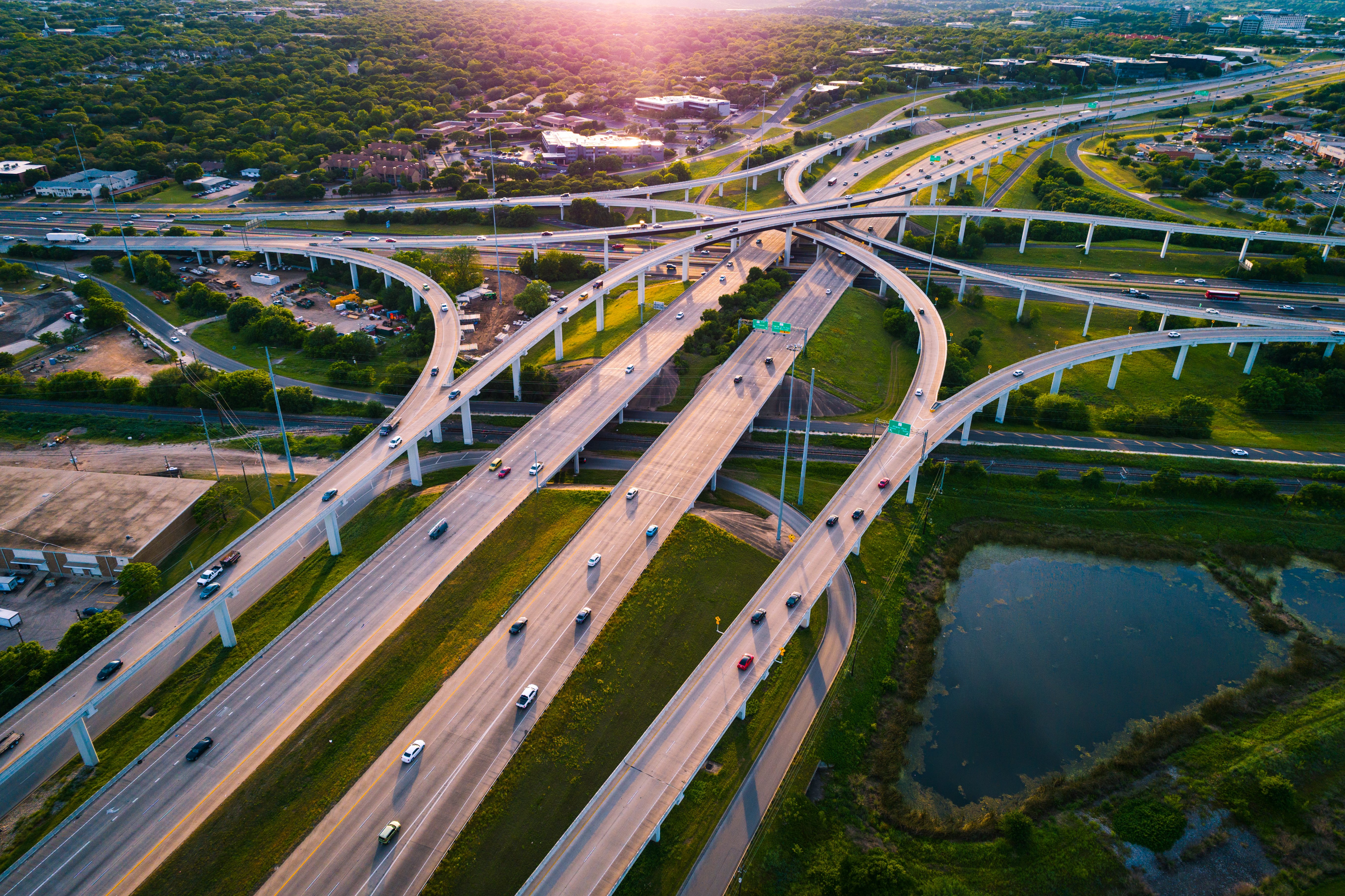 Highway Interchange loops and turnarounds , travel destination and following the busy highway system aerial drone look looking down from above curved raised roadways in Austin Texas USA